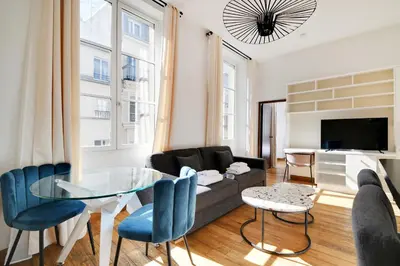 Télévision ou salle de divertissement dans l'établissement Residence central marais
