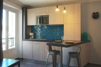 Cuisine ou kitchenette dans l'établissement thesuites Paris Studios