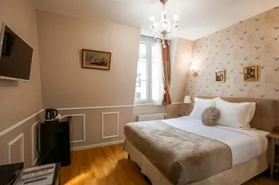 Un ou plusieurs lits dans un hébergement de l'établissement La Maison Gobert Paris Hotel Particulier