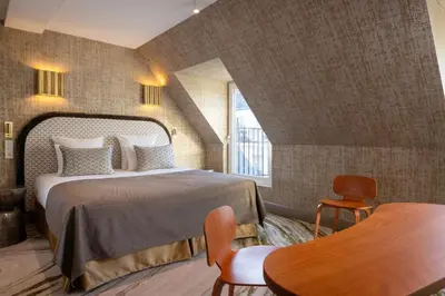Un ou plusieurs lits dans un hébergement de l'établissement Hotel des Carmes by Malone