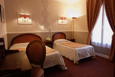 Un ou plusieurs lits dans un hébergement de l'établissement Hôtel Chopin