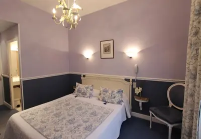 Un ou plusieurs lits dans un hébergement de l'établissement Hôtel Chopin