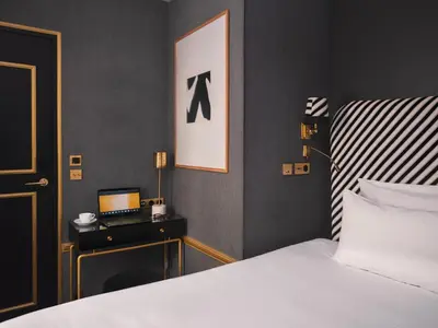 Un ou plusieurs lits dans un hébergement de l'établissement Snob Hotel