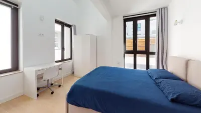 Un ou plusieurs lits dans un hébergement de l'établissement Stunning And Luxurious 3BR Loft 5min From Paris In The Heart Of Boulogne