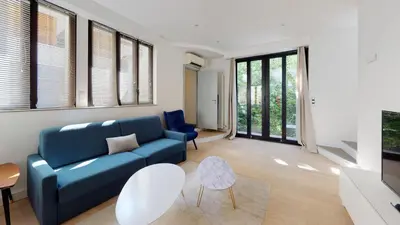 Coin salon dans l'établissement Stunning And Luxurious 3BR Loft 5min From Paris In The Heart Of Boulogne