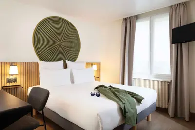 Un ou plusieurs lits dans un hébergement de l'établissement Hotel Korner Sorbonne