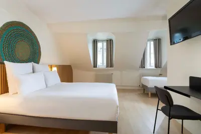 Un ou plusieurs lits dans un hébergement de l'établissement Hotel Korner Sorbonne