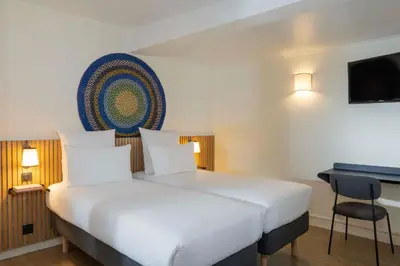 Un ou plusieurs lits dans un hébergement de l'établissement Hotel Korner Sorbonne