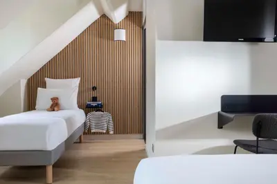 Un ou plusieurs lits dans un hébergement de l'établissement Hotel Korner Sorbonne