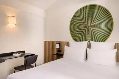 Un ou plusieurs lits dans un hébergement de l'établissement Hotel Korner Sorbonne