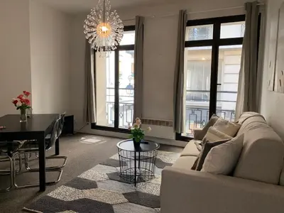 Coin salon dans l'établissement Sweet Home Paris Apartment