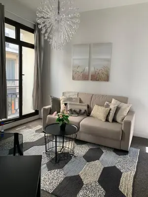 Coin salon dans l'établissement Sweet Home Paris Apartment