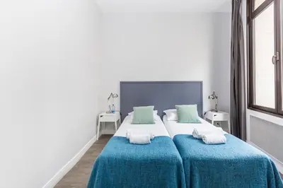 Un ou plusieurs lits dans un hébergement de l'établissement Sweet Home Paris Apartment