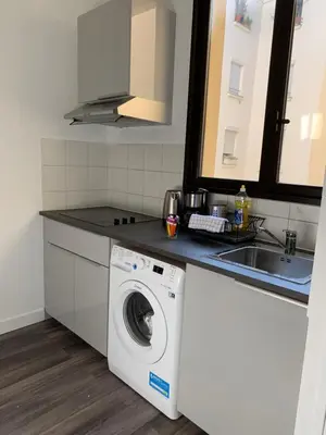 Cuisine ou kitchenette dans l'établissement Sweet Home Paris Apartment