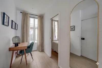 Un ou plusieurs lits dans un hébergement de l'établissement Residence Tour Eiffel by Studio prestige