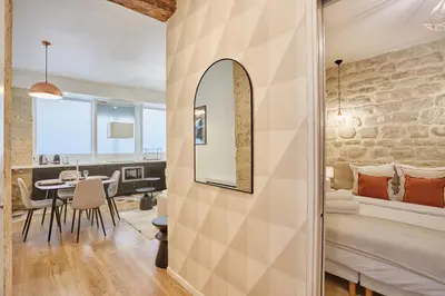 Un ou plusieurs lits dans un hébergement de l'établissement Residence Tour Eiffel by Studio prestige