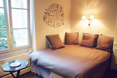 Un ou plusieurs lits dans un hébergement de l'établissement Petit Paris - Oasis in Marais