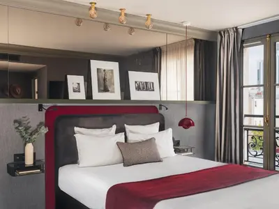 Un ou plusieurs lits dans un hébergement de l'établissement Bob Hotel