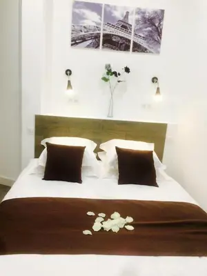 Un ou plusieurs lits dans un hébergement de l'établissement Le Logis de Montmartre
