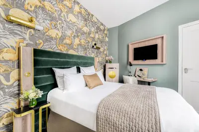 Un ou plusieurs lits dans un hébergement de l'établissement Hotel Opéra Opal