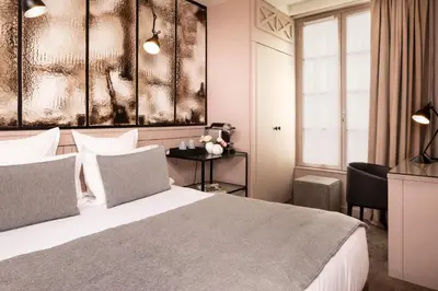 Un ou plusieurs lits dans un hébergement de l'établissement Hôtel Hélios Opéra