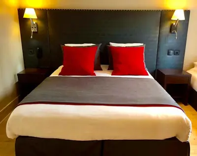 Un ou plusieurs lits dans un hébergement de l'établissement Hotel Migny Opéra Montmartre