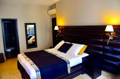 Un ou plusieurs lits dans un hébergement de l'établissement Hotel Migny Opéra Montmartre