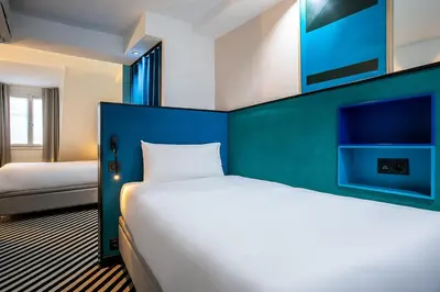 Un ou plusieurs lits dans un hébergement de l'établissement Hotel Pilime