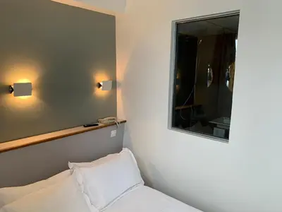 Un ou plusieurs lits dans un hébergement de l'établissement Picardy Hôtel-Gare du Nord