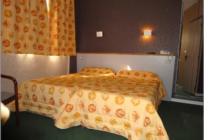 Un ou plusieurs lits dans un hébergement de l'établissement Picardy Hôtel-Gare du Nord