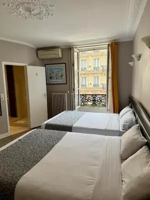 Un ou plusieurs lits dans un hébergement de l'établissement New Hôtel Gare Du Nord