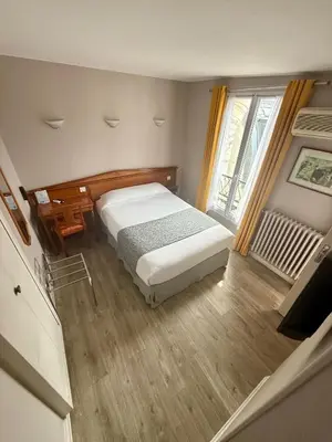 Un ou plusieurs lits dans un hébergement de l'établissement New Hôtel Gare Du Nord