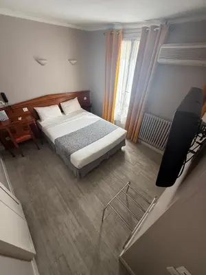 Un ou plusieurs lits dans un hébergement de l'établissement New Hôtel Gare Du Nord