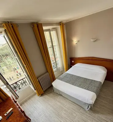 Un ou plusieurs lits dans un hébergement de l'établissement New Hôtel Gare Du Nord