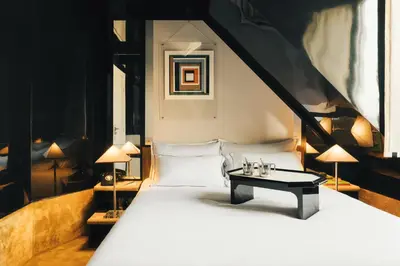 Un ou plusieurs lits dans un hébergement de l'établissement Hôtel Château d'Eau