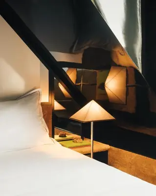 Un ou plusieurs lits dans un hébergement de l'établissement Hôtel Château d'Eau