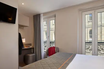 Un ou plusieurs lits dans un hébergement de l'établissement Timhotel Paris Gare de l'Est