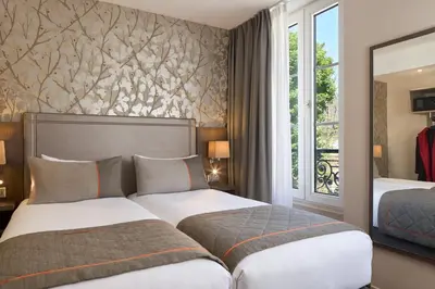 Un ou plusieurs lits dans un hébergement de l'établissement Timhotel Paris Gare de l'Est