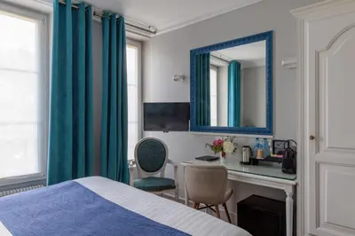 Un ou plusieurs lits dans un hébergement de l'établissement Hôtel Saint Martin Bastille