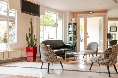 Télévision ou salle de divertissement dans l'établissement Hôtel Baldi by Magna Arbor