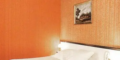 Un ou plusieurs lits dans un hébergement de l'établissement Avenir Hotel