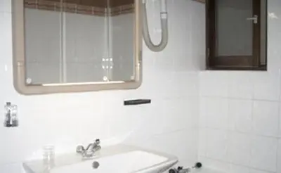 Salle de bains dans l'établissement Avenir Hotel
