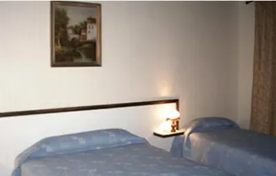 Un ou plusieurs lits dans un hébergement de l'établissement Avenir Hotel