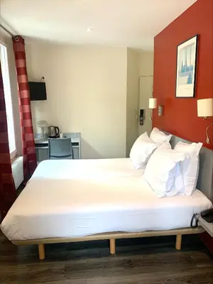 Un ou plusieurs lits dans un hébergement de l'établissement Hipotel Belgrand Edith Piaf