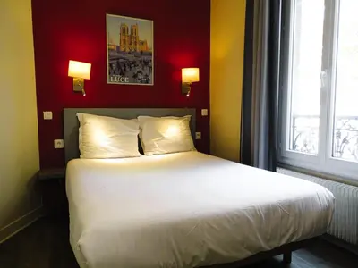 Un ou plusieurs lits dans un hébergement de l'établissement Hipotel Belgrand Edith Piaf