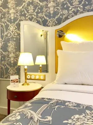 Un ou plusieurs lits dans un hébergement de l'établissement Hôtel Mayfair Paris