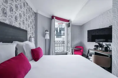 Un ou plusieurs lits dans un hébergement de l'établissement Maison Astor Paris, Curio Collection by Hilton