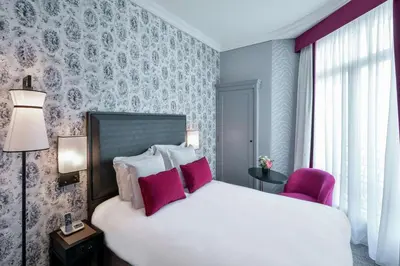 Un ou plusieurs lits dans un hébergement de l'établissement Maison Astor Paris, Curio Collection by Hilton