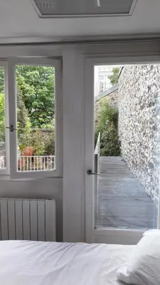 Un ou plusieurs lits dans un hébergement de l'établissement Villa des iris