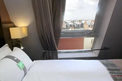 Un ou plusieurs lits dans un hébergement de l'établissement Holiday Inn Paris Montmartre by IHG